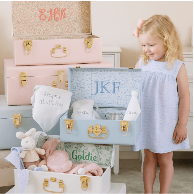 Handcrafted wooden keepsake trunk with personalized monogram for storing baby mementos